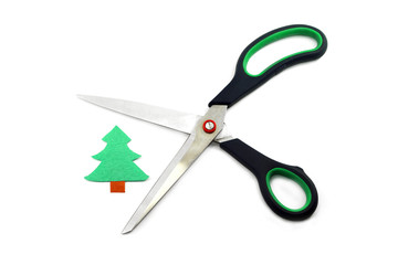 Ecology concept: paper tree being cut by scissors