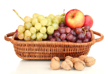 Grape in basket with nuts isolated on white