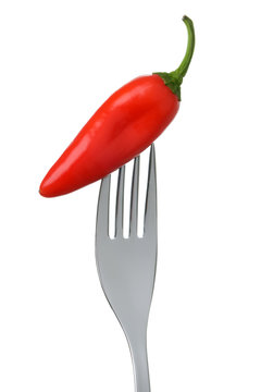 chili pepper on a fork on white © eelnosiva