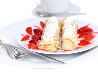 Pankcake with cream , with rolled fruit inside.