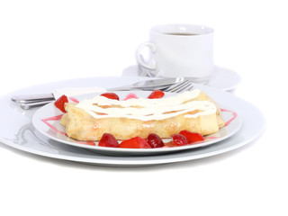 Pankcake with cream , with rolled fruit inside.
