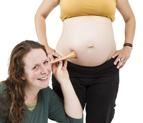 midwife listening at human belly