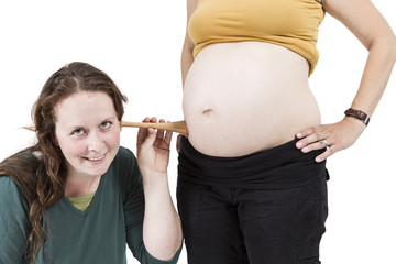 midwife listening at human belly