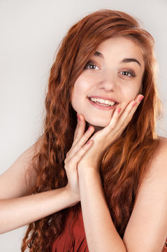 Smiling beautiful red haired girl at age of nineteen