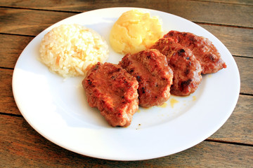 Meatball plate with rice and mashed potatoes