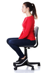 Young happy woman sitting on a wheel chair