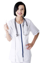 Female doctor or nurse holding digital thermometer