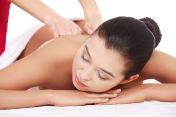 Fototapeta na wymiar Young woman relaxing beeing massaged