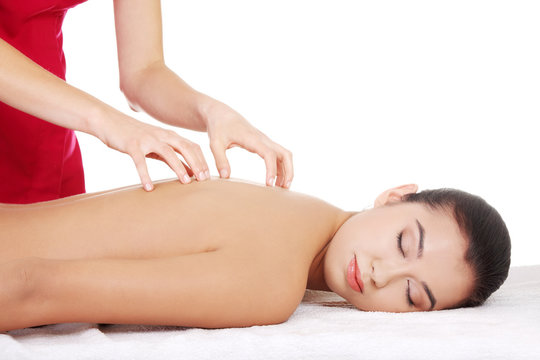 Young woman relaxing beeing massaged