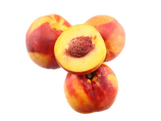 A few peaches with slice of one,on white.Isolated