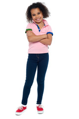 Fashionable trendy girl striking a stylish pose