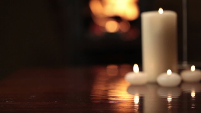 Glasses of champagne near fireplace