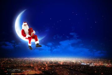 Obraz na płótnie Canvas Santa na Księżycu