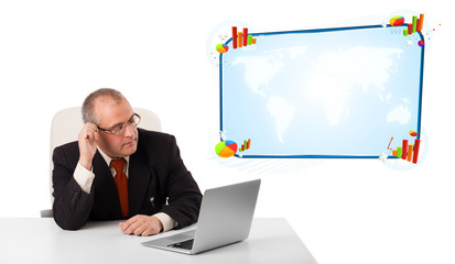 businessman sitting at desk and looking the laptop with copy spa