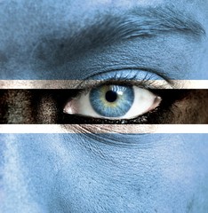 Human face painted with flag of Botswana