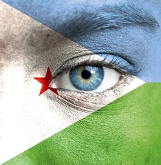 Human face painted with flag of Djibouti