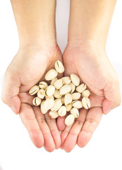 pistachio in hands isolated on white background