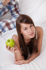 Young woman with apple