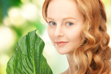 Naklejka premium woman with green leaf