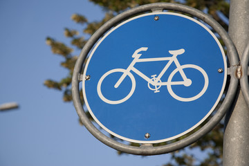 Blue Bike Symbol Sign in an Urban Setting