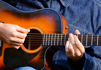 Close up of male hands playing guitar © irishmaster