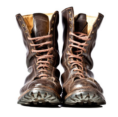 Old brown leather combat boots on a white background