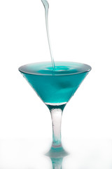 Cocktail poured into martini glass isolated on white
