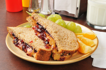 Peanut butter and jelly sandwich with fruit