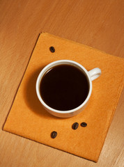 One white coffee cup on a napkin