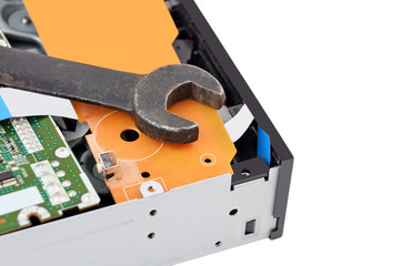 Detailed view of the inside of dvd disk drive and wrench