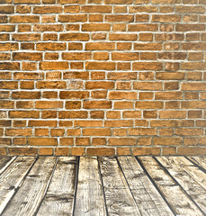 Empty old spacious room with stone grungy wall and wood floor