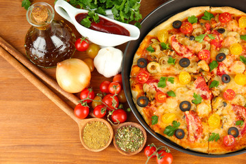 colorful composition of delicious pizza, vegetables and spices