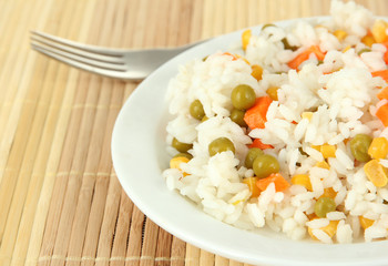 Risotto on plate on light background
