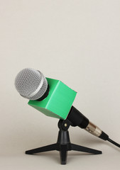 Microphone on stand on grey background