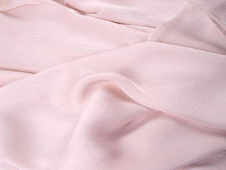 Fototapeta premium light pink silk drape, background or texture