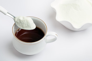Cup of tea with dairy milk powder