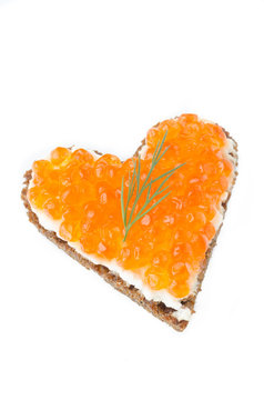 sandwich with red caviar in the form of a heart  isolated