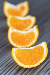 Obraz na płótnie Canvas oranges on a wooden table