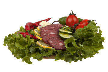 Sausage with vegetables on board