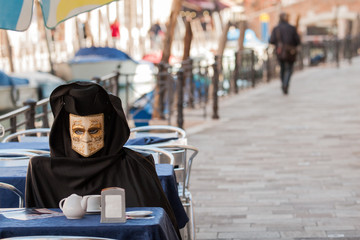 Mask in San Marco square during carnival of Venice