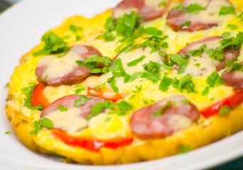 Omelet with sausage and vegetables