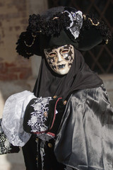 Mask in San Marco square during carnival of Venice