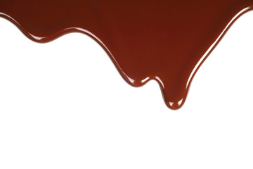 Melted chocolate dripping on white background .