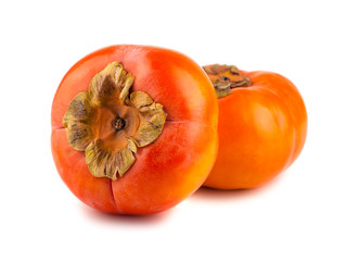 Two ripe persimmon fruits