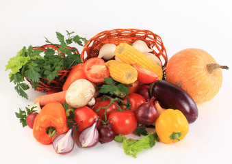 Composition with raw vegetables and wicker basket