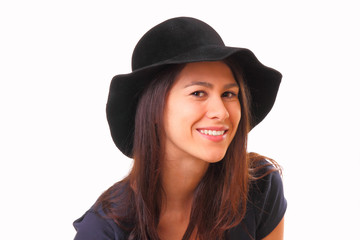 Pretty and smiling young woman in a black hat