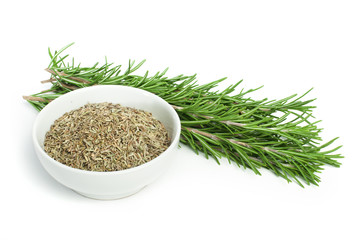 Fresh rosemary and a bowl with dried