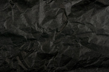 Crumpled black paper