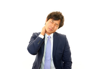 肩こりに苦しむビジネスマン