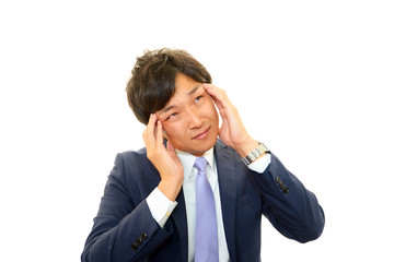 頭痛を訴えるビジネスマン